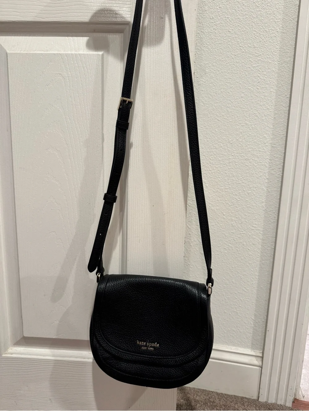 kate spade Black Pebbled Leather Saddle Crossbody with Gold Logo and hardware